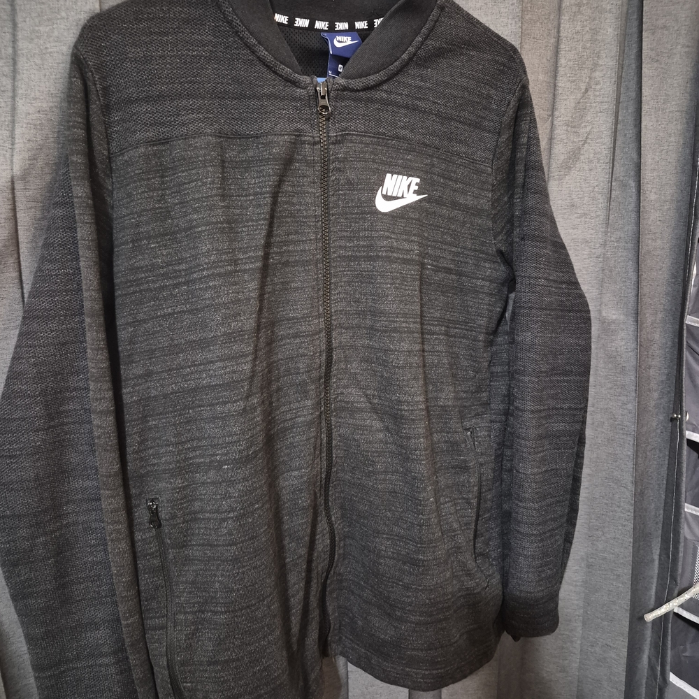 Nike Black Jacket with White Logo and Blue Tag